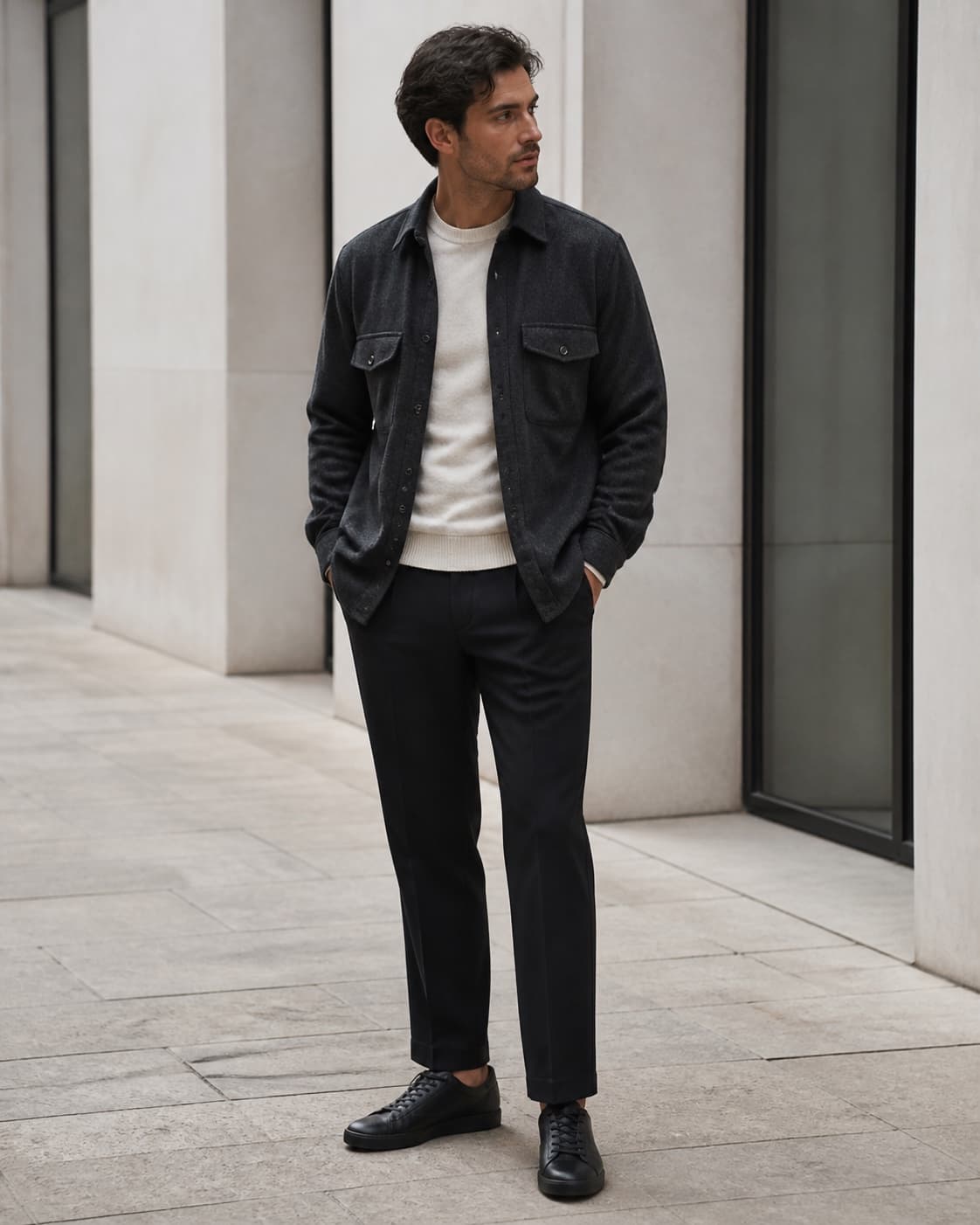 Man wearing a considered charcoal overshirt and tailored trousers